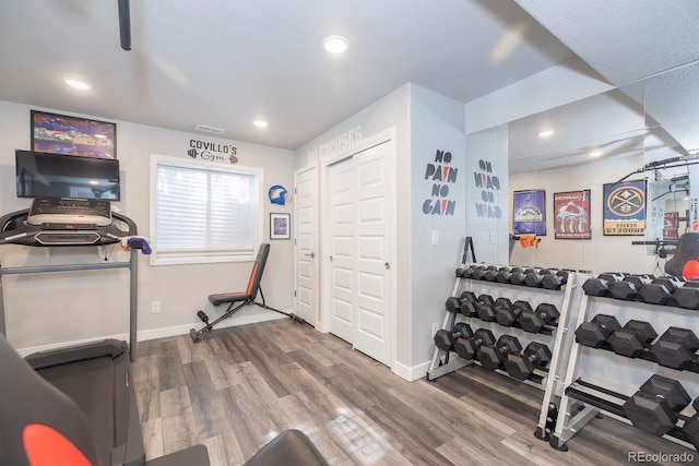16102 Grebe Pl, Parker, CO 80134 - exercise room featuring recessed lighting, wood finished floors, and baseboards