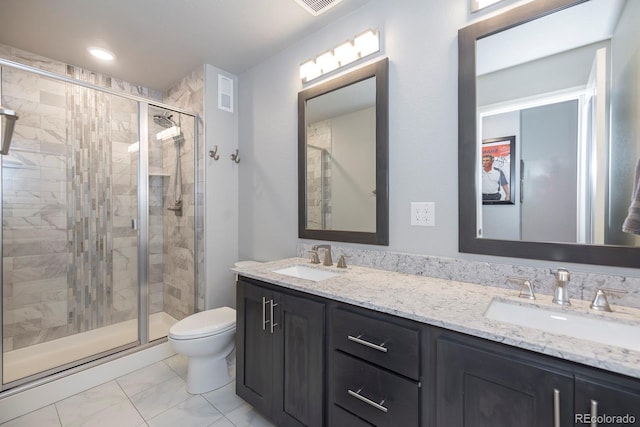 16102 Grebe Pl, Parker, CO 80134 - full bath with marble look tile flooring, toilet, double vanity, and a stall shower