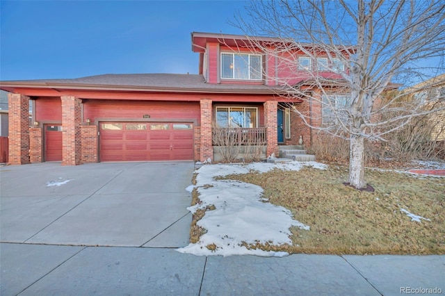 view of front of house featuring a garage and a porch