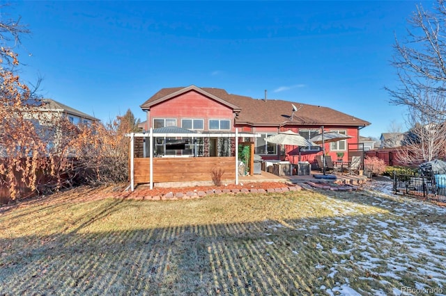 back of house featuring a patio area and a yard