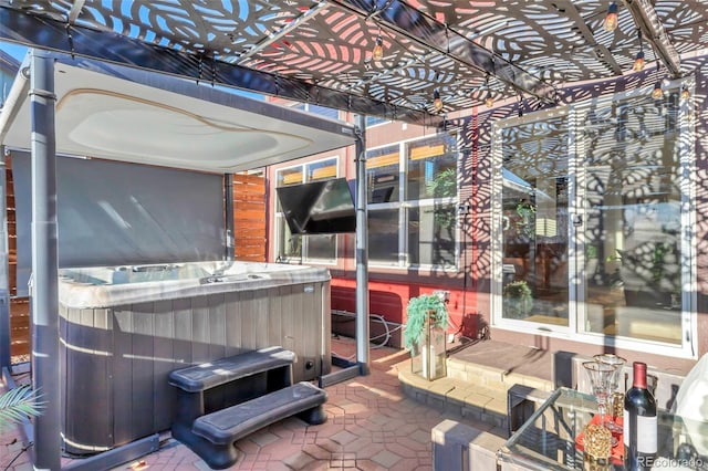 view of patio featuring a hot tub and a pergola