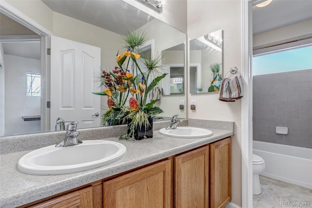 full bathroom featuring toilet, vanity, shower / washtub combination, and tile patterned flooring