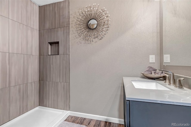 bathroom featuring wood-type flooring and vanity