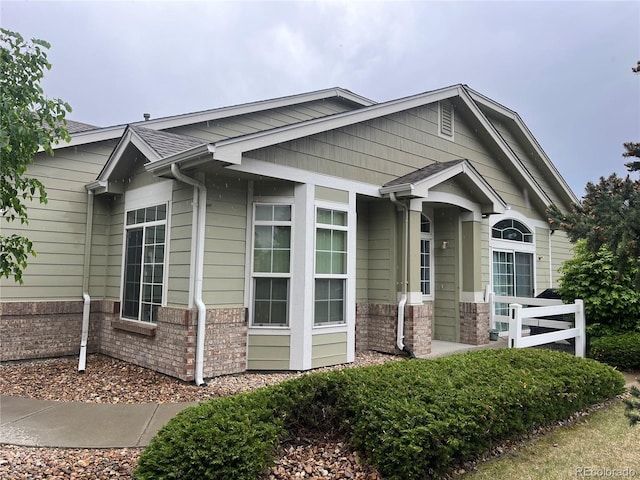 14400 Albrook Dr Unit 88, Denver, CO 80239 - view of side of home featuring brick siding