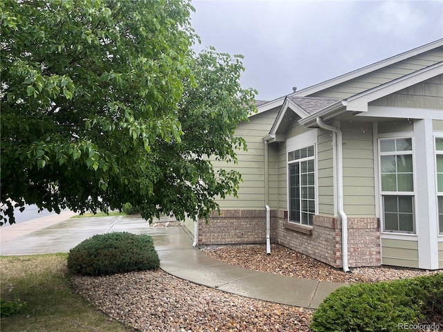 14400 Albrook Dr Unit 88, Denver, CO 80239 - view of side of home with brick siding