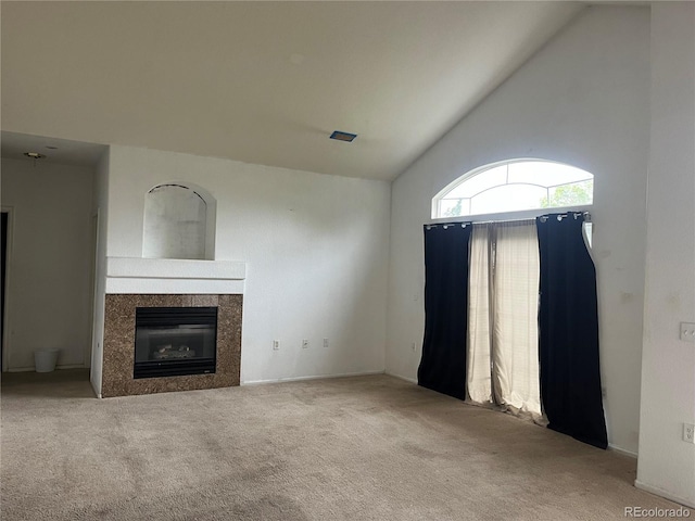 14400 Albrook Dr Unit 88, Denver, CO 80239 - unfurnished living room with carpet floors, a fireplace, and high vaulted ceiling