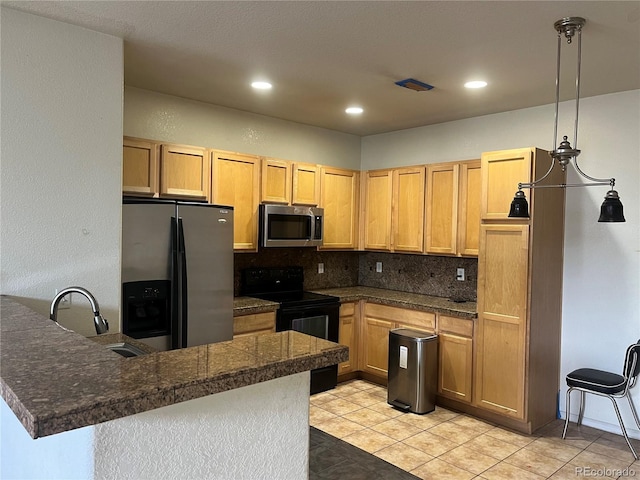 14400 Albrook Dr Unit 88, Denver, CO 80239 - kitchen with appliances with stainless steel finishes, tile counters, a peninsula, decorative backsplash, and a sink
