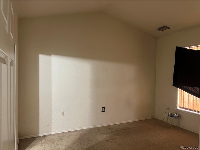 14400 Albrook Dr Unit 88, Denver, CO 80239 - carpeted spare room with vaulted ceiling and baseboards