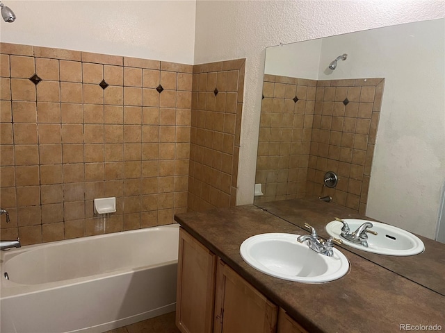 14400 Albrook Dr Unit 88, Denver, CO 80239 - bathroom with tub / shower combination, vanity, and a textured wall