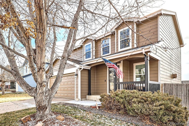 view of front of house featuring a porch and a garage