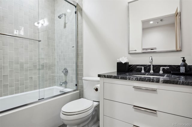 full bathroom with vanity, toilet, and bath / shower combo with glass door