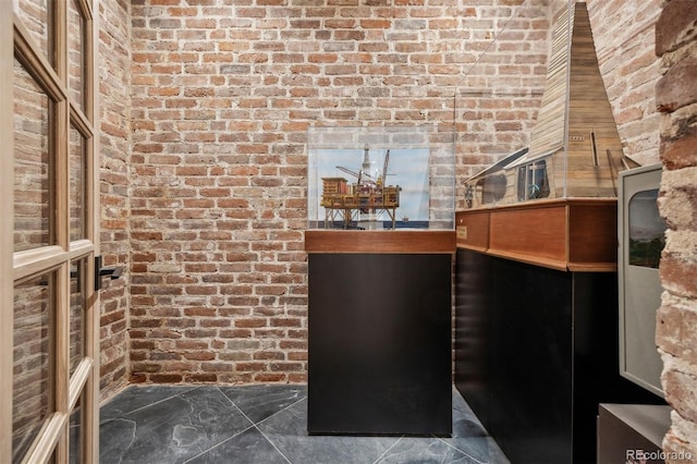 interior space with brick wall