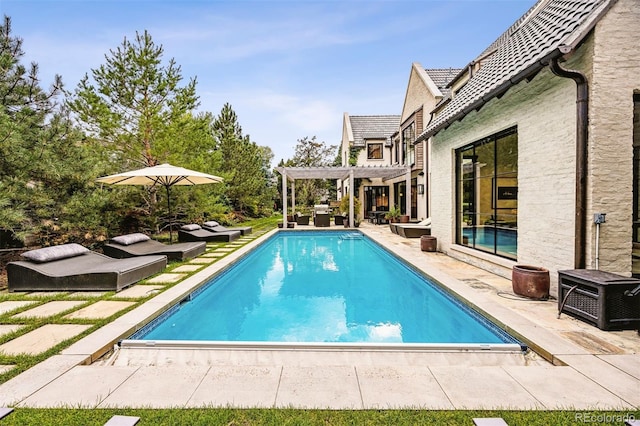 view of pool featuring a pergola and a patio