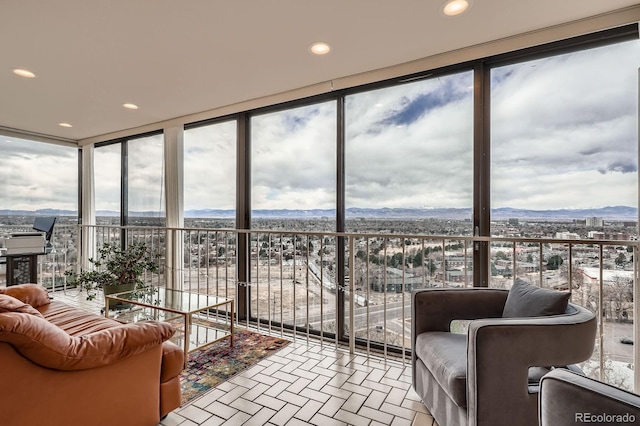 sunroom featuring a mountain view