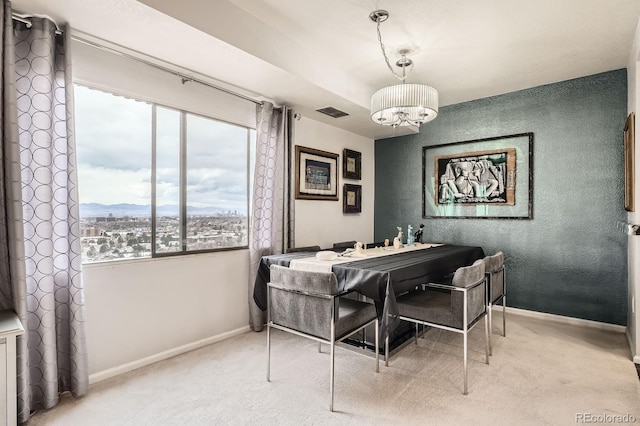 dining area featuring visible vents, baseboards, and carpet flooring