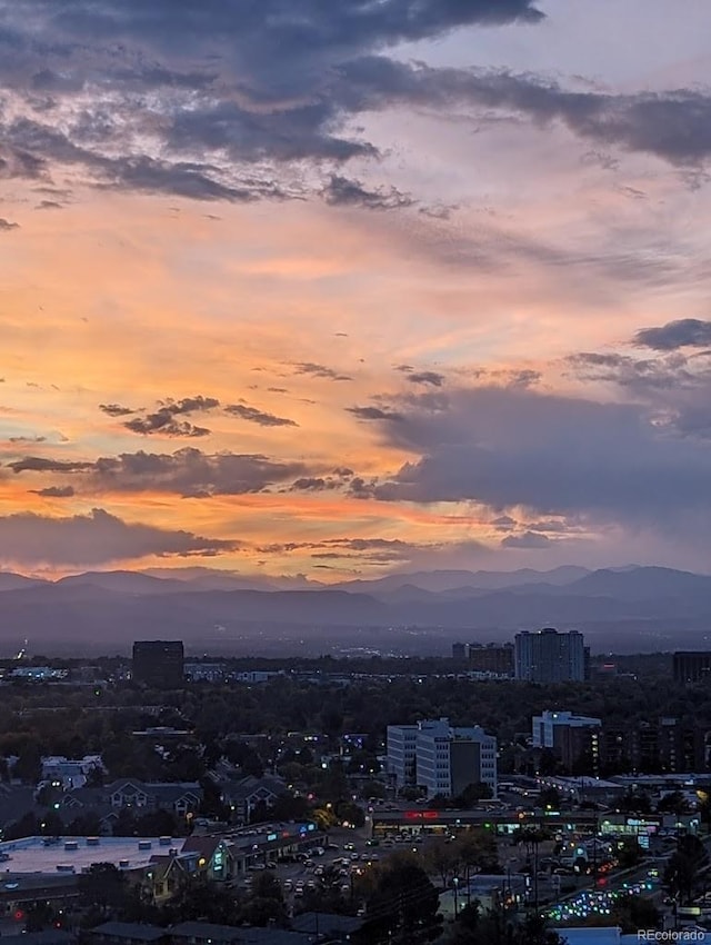 property's view of city featuring a mountain view