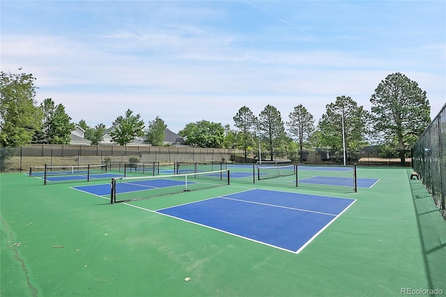 view of tennis court with fence