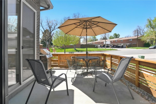 12497 W Virginia Ave, Lakewood, CO 80228 - view of patio with a grill, a residential view, and outdoor dining area