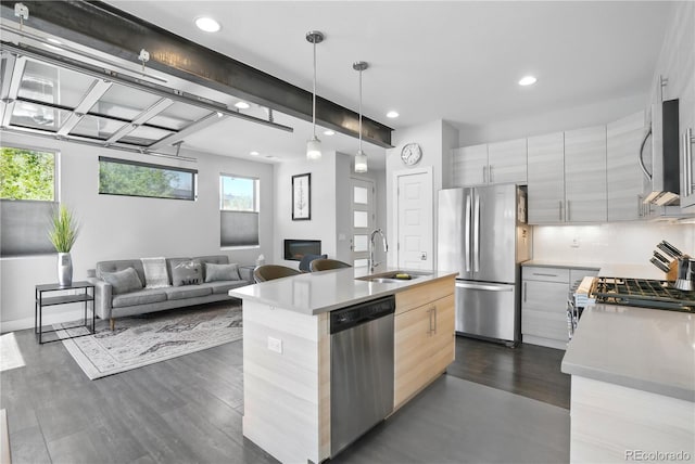 12497 W Virginia Ave, Lakewood, CO 80228 - kitchen with recessed lighting, dark wood-style flooring, modern cabinets, a sink, and stainless steel appliances
