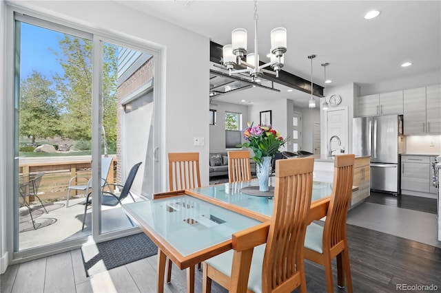 12497 W Virginia Ave, Lakewood, CO 80228 - dining space with recessed lighting, a chandelier, and light wood-type flooring
