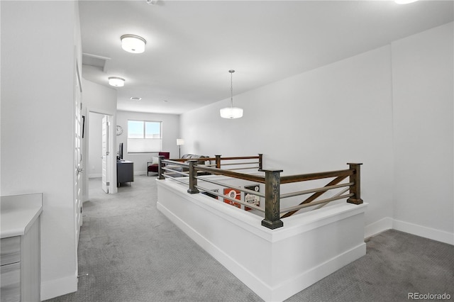 12497 W Virginia Ave, Lakewood, CO 80228 - corridor with light carpet, an upstairs landing, and baseboards