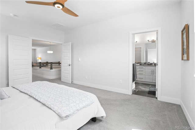12497 W Virginia Ave, Lakewood, CO 80228 - bedroom featuring baseboards, ensuite bathroom, a ceiling fan, and carpet floors