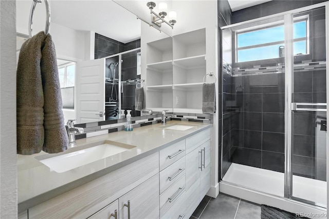 12497 W Virginia Ave, Lakewood, CO 80228 - full bathroom featuring a stall shower, tile patterned flooring, and double vanity