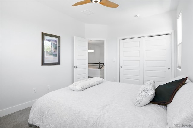 12497 W Virginia Ave, Lakewood, CO 80228 - carpeted bedroom with a closet, visible vents, baseboards, and a ceiling fan