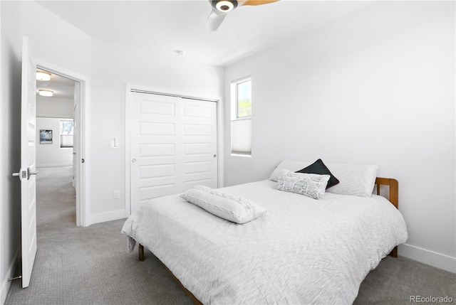 12497 W Virginia Ave, Lakewood, CO 80228 - carpeted bedroom featuring a closet, multiple windows, baseboards, and ceiling fan