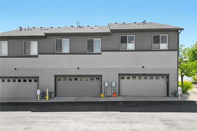 12497 W Virginia Ave, Lakewood, CO 80228 - back of property featuring an attached garage