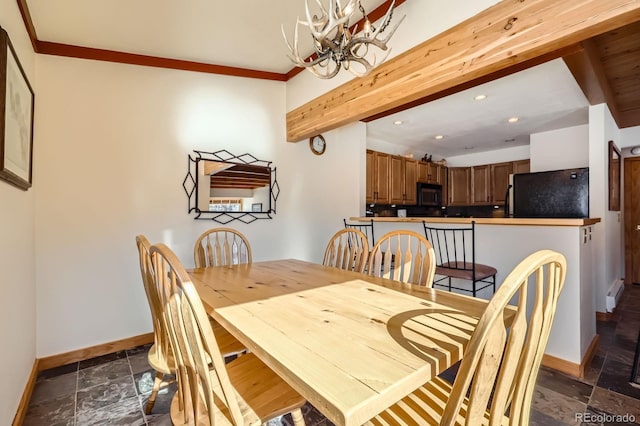 dining space featuring beam ceiling, crown molding, a baseboard heating unit, and a chandelier