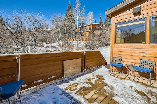 view of snow covered deck