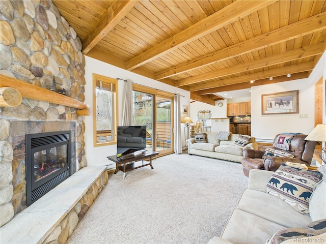 560 Tennis Club Rd Unit 1333, Dillon, CO 80435 - living area with carpet floors, a wood ceiling with exposed beams, a fireplace, and a baseboard radiator