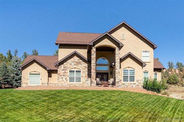 french country style house with a front lawn