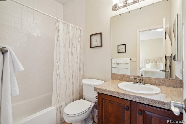 full bathroom with vanity, shower / tub combo with curtain, and toilet