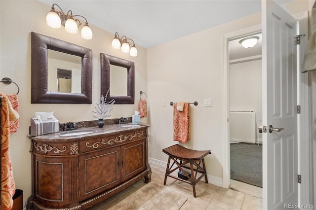 bathroom with tile patterned flooring and vanity