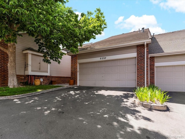 9323 Notts Ct, Lone Tree, CO 80124 - view of front of property with brick siding and asphalt driveway
