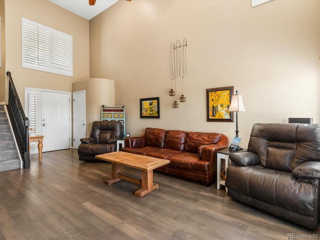 9323 Notts Ct, Lone Tree, CO 80124 - living area with stairs, dark wood-style flooring, a high ceiling, and ceiling fan