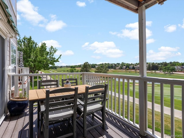 9323 Notts Ct, Lone Tree, CO 80124 - deck with outdoor dining area, a yard, golf course view, and a water view