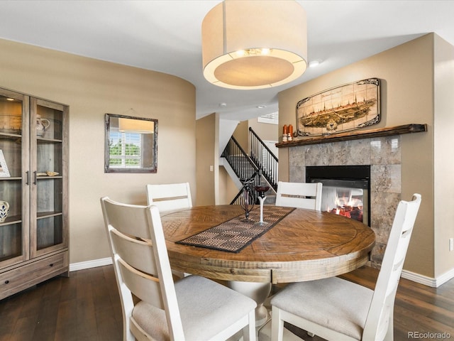 9323 Notts Ct, Lone Tree, CO 80124 - dining space with wood finished floors, a fireplace, and stairway