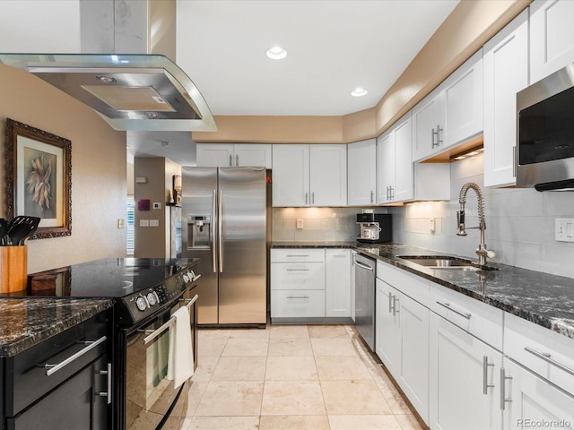 9323 Notts Ct, Lone Tree, CO 80124 - kitchen with appliances with stainless steel finishes, exhaust hood, backsplash, white cabinetry, and recessed lighting