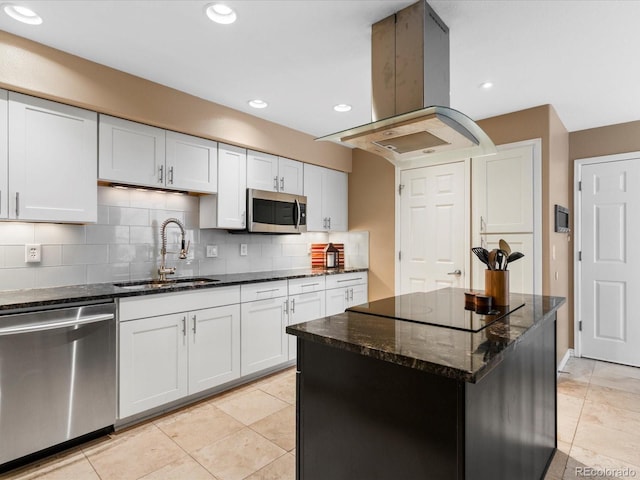 9323 Notts Ct, Lone Tree, CO 80124 - kitchen featuring stainless steel appliances, island range hood, dark stone counters, tasteful backsplash, and a center island