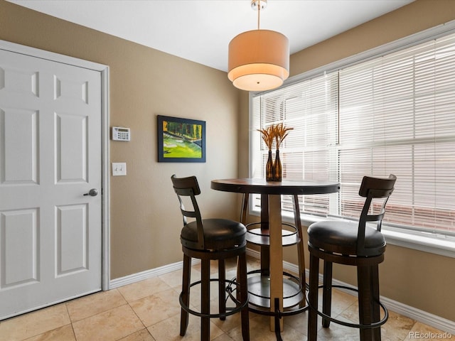 9323 Notts Ct, Lone Tree, CO 80124 - dining area with light tile patterned floors and plenty of natural light