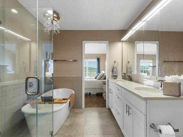 9323 Notts Ct, Lone Tree, CO 80124 - ensuite bathroom featuring double vanity, healthy amount of natural light, a freestanding tub, and a shower stall