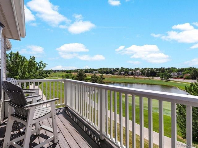9323 Notts Ct, Lone Tree, CO 80124 - wooden terrace with a water view and a lawn