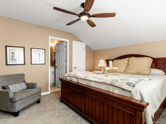9323 Notts Ct, Lone Tree, CO 80124 - bedroom with light carpet, vaulted ceiling, connected bathroom, and a ceiling fan