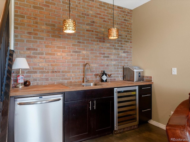 9323 Notts Ct, Lone Tree, CO 80124 - indoor wet bar featuring wine cooler, stainless steel dishwasher, dark wood finished floors, and hanging light fixtures