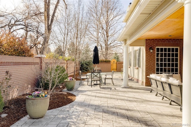 view of patio featuring a fenced backyard and outdoor dining space