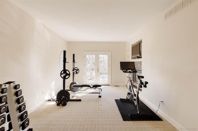 workout room with visible vents, french doors, baseboards, and carpet