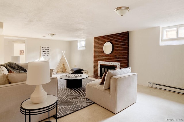 living area featuring a healthy amount of sunlight, a brick fireplace, and a textured ceiling